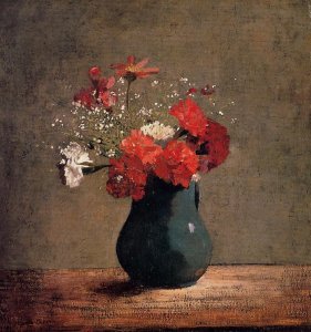 Carnations and baby's breath in a green pitcher